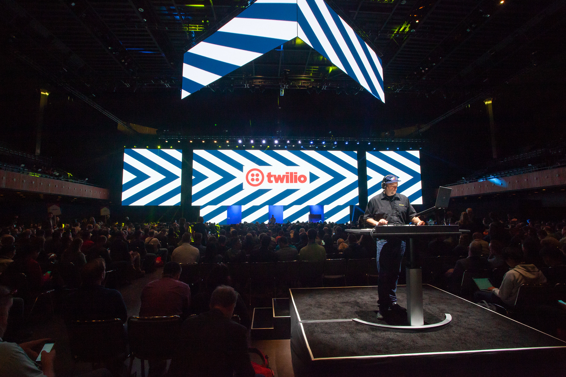 Production booth at Twilio Signal conference with broadcast desk and stage